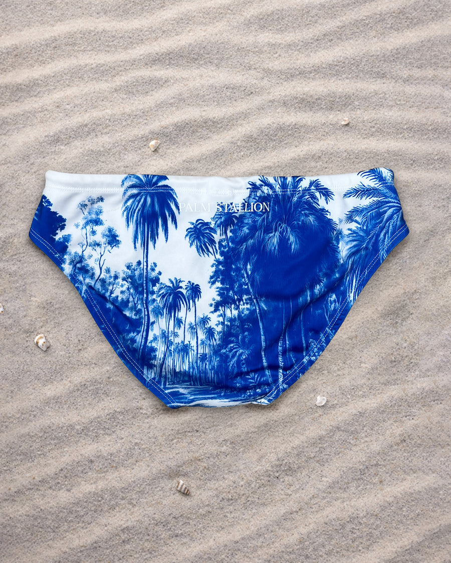 Palm Stallion Blue Jungle men’s swim briefs with blue palm print, low-rise high-cut swim brief, fully lined, adjustable white drawcord with gold tips