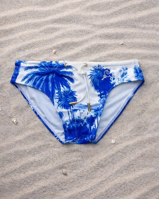 Palm Stallion Blue Jungle men’s swim briefs with blue palm print, low-rise high-cut swim brief, fully lined, adjustable white drawcord with gold tips